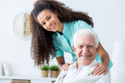 caregiver assisting an elder